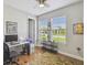 Bright bedroom with natural light, a desk area and view of the well-maintained lawn at 249 Bella Cortina Dr, Kissimmee, FL 34759