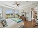 Spacious main bedroom boasts an expansive layout, tray ceilings, and views of backyard at 249 Bella Cortina Dr, Kissimmee, FL 34759