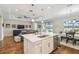 Open floor plan with hardwood floors, modern lighting, and a view of the backyard at 249 Bella Cortina Dr, Kissimmee, FL 34759