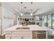 Open concept living area with modern lighting and a view of the bedroom and screened in patio at 249 Bella Cortina Dr, Kissimmee, FL 34759