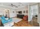 Cozy living room with hardwood floors and ceiling fan at 249 Bella Cortina Dr, Kissimmee, FL 34759