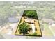 Overhead view of home with large, private backyard surrounded by mature trees at 2560 Greenwood Dr, Kissimmee, FL 34744