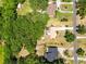 Expansive aerial view of property showcasing lush greenery and well-maintained landscaping at 2560 Greenwood Dr, Kissimmee, FL 34744