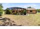 Backyard featuring screened in patio and mature landscaping at 2560 Greenwood Dr, Kissimmee, FL 34744