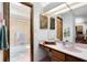 Bathroom featuring a combined shower and tub, vanity with sink, and decorative mirror at 2560 Greenwood Dr, Kissimmee, FL 34744