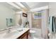 Neutral bathroom with shower/tub combo and updated vanity offers a clean design at 2560 Greenwood Dr, Kissimmee, FL 34744