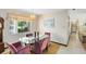 Formal dining room features a glass-topped table and six upholstered chairs at 2560 Greenwood Dr, Kissimmee, FL 34744