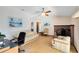 Bright and airy living room featuring a cozy seating area and a fireplace at 2560 Greenwood Dr, Kissimmee, FL 34744