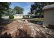 Large backyard with a fire pit and plenty of room for entertaining or relaxing at 26 College Dr, Babson Park, FL 33827
