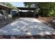 Backyard featuring a concrete paver patio and a covered structure in the background at 26 College Dr, Babson Park, FL 33827