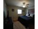 Inviting bedroom with neutral colors, hardwood floors, a ceiling fan, and lots of natural light at 26 College Dr, Babson Park, FL 33827