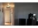 View of a long hallway connecting various rooms in the house with hardwood floors at 26 College Dr, Babson Park, FL 33827