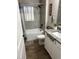 Updated bathroom with tiled shower/tub, and a white vanity with solid surface counters at 2943 Annalee Rd, St Cloud, FL 34771