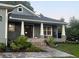Inviting front porch and walkway with stone accents and beautifully landscaped yard at 2943 Annalee Rd, St Cloud, FL 34771