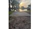 Concrete boat launch ramp leading into a serene body of water at sunset at 2943 Annalee Rd, St Cloud, FL 34771