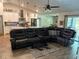 Open-concept living space with kitchen view, featuring modern furnishings and decor at 2943 Annalee Rd, St Cloud, FL 34771