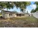This home features a spacious backyard with a screened lanai at 301 Lake Ned Rd, Winter Haven, FL 33884
