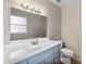 Bathroom featuring a vanity and toilet at 301 Lake Ned Rd, Winter Haven, FL 33884