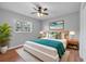 This beautiful bedroom is decorated with a beach themed art and rug at 301 Lake Ned Rd, Winter Haven, FL 33884
