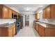 Functional kitchen with wood cabinets, granite countertops, and modern appliances at 301 Lake Ned Rd, Winter Haven, FL 33884