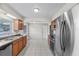 Well-lit kitchen featuring stainless steel appliances and tile flooring at 301 Lake Ned Rd, Winter Haven, FL 33884