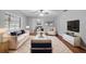 Stylishly furnished living room featuring a large rug, sofa, and modern decor at 301 Lake Ned Rd, Winter Haven, FL 33884