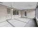This covered patio has block walls and two doors at 301 Lake Ned Rd, Winter Haven, FL 33884