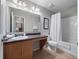 Wheelchair accessible bathroom with roll-under vanity and shower-tub combo at 3071 Seaview Castle Dr, Kissimmee, FL 34746