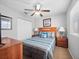 Bedroom with large window, ceiling fan, and comfortable full-sized bed at 3071 Seaview Castle Dr, Kissimmee, FL 34746