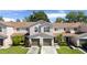 This is an aerial view of a well-maintained townhouse with a two-car garage and green lawn at 3071 Seaview Castle Dr, Kissimmee, FL 34746