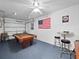 This large game room includes a pool table, a high-top table with bar stools, and patriotic decor at 3071 Seaview Castle Dr, Kissimmee, FL 34746