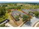 An aerial view of a well-maintained home, highlighted with a red outline and a screened-in pool area at 308 Yellow Snapdragon Dr, Davenport, FL 33837