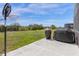 Spacious backyard with a basketball hoop and outdoor cooking facilities at 308 Yellow Snapdragon Dr, Davenport, FL 33837