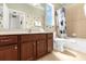 Full bathroom featuring a vanity and shower and tub combo and Mickey Mouse decor at 308 Yellow Snapdragon Dr, Davenport, FL 33837