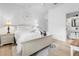 Serene bedroom offers natural light, soft tones, and a glimpse of an en-suite bathroom at 308 Yellow Snapdragon Dr, Davenport, FL 33837