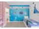 Fun bedroom with a bed and a whimsical Frozen-themed decor and an adjoining room at 308 Yellow Snapdragon Dr, Davenport, FL 33837