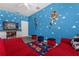 Fun bedroom with Toy Story theme, comfy seating, and television at 308 Yellow Snapdragon Dr, Davenport, FL 33837
