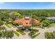 Beautiful community clubhouse with lovely landscaping, a fountain, and palm trees creating a welcoming environment at 308 Yellow Snapdragon Dr, Davenport, FL 33837