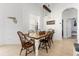Comfortable dining area with a wooden table, seating for six, and bright natural light at 308 Yellow Snapdragon Dr, Davenport, FL 33837