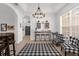 Cozy breakfast nook with chandelier and bar seating perfect for casual dining and entertaining at 308 Yellow Snapdragon Dr, Davenport, FL 33837