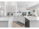 Bright kitchen with ample countertop space, stainless steel appliances, and open layout at 308 Yellow Snapdragon Dr, Davenport, FL 33837