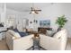 Spacious living room with vaulted ceiling, ceiling fan, and comfortable seating arrangement at 308 Yellow Snapdragon Dr, Davenport, FL 33837