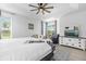 Spacious main bedroom featuring tray ceiling and natural light at 308 Yellow Snapdragon Dr, Davenport, FL 33837