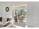 View from the living room to the screened patio, with outdoor seating and views of the pool at 308 Yellow Snapdragon Dr, Davenport, FL 33837
