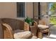 Inviting patio area with comfortable wicker seating, perfect for relaxation at 308 Yellow Snapdragon Dr, Davenport, FL 33837
