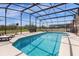 Gorgeous pool with sun-drenched pool deck and screened-in enclosure at 308 Yellow Snapdragon Dr, Davenport, FL 33837