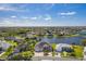 Scenic aerial view of a lakeside community showcasing well-maintained homes and lush surroundings at 3181 Bayview Ln, St Cloud, FL 34772