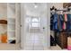Elegant bathroom seen through a walk-in closet, featuring a tub and shower at 3181 Bayview Ln, St Cloud, FL 34772