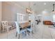 Inviting dining room with wood table and chairs, and a stylish light fixture at 3181 Bayview Ln, St Cloud, FL 34772