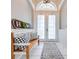 Charming entryway with a wooden bench and a decorative 'HOME' sign at 3181 Bayview Ln, St Cloud, FL 34772